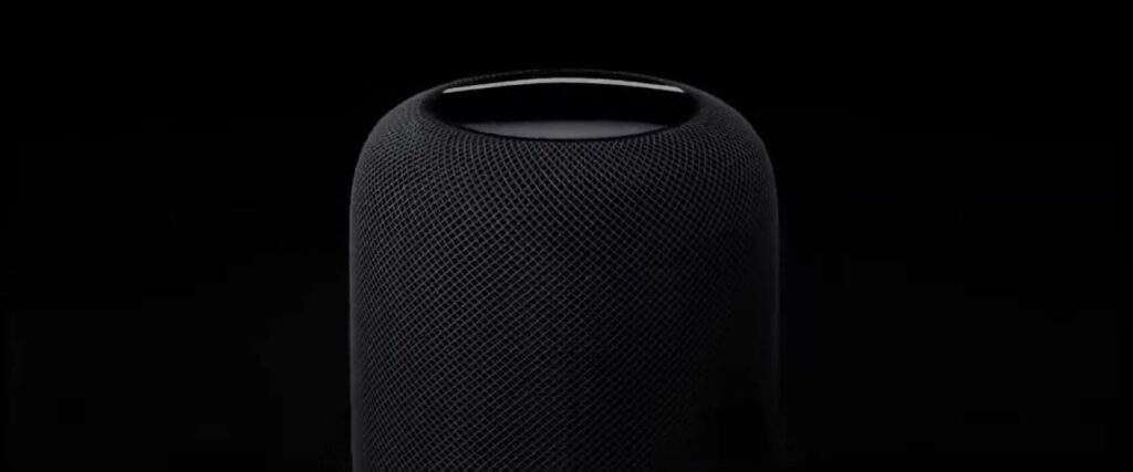 Een HomePod-speaker van Apple tegen een donkere achtergrond